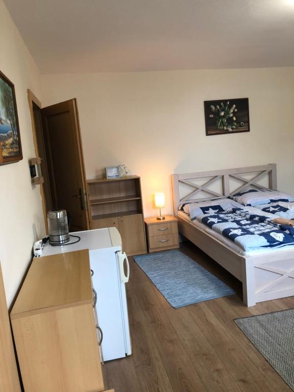 Postel nebo postele na pokoji v ubytování Privát Migáč