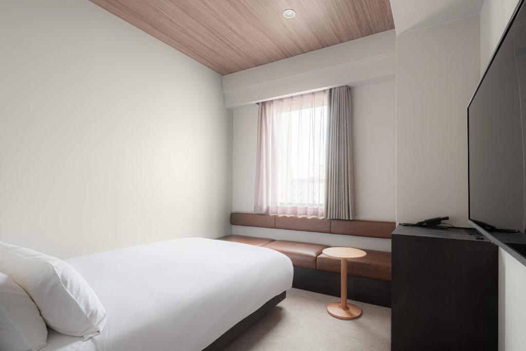 TV a/nebo společenská místnost v ubytování Nest Hotel Hiroshima Ekimae