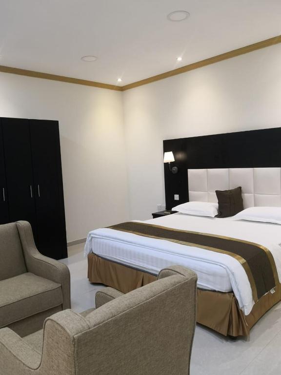 Postel nebo postele na pokoji v ubytování روح الأصيلة للشقق المخدومة Roh Alaseilah Serviced Apartments