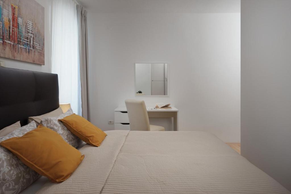 Łóżko lub łóżka w pokoju w obiekcie Apartments Antons