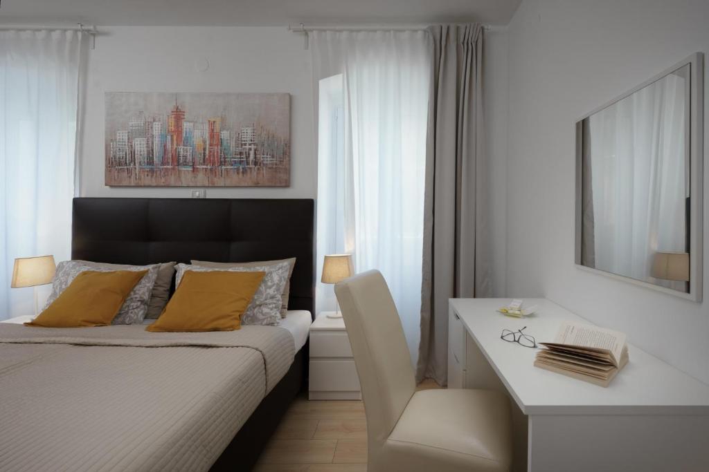 Łóżko lub łóżka w pokoju w obiekcie Apartments Antons