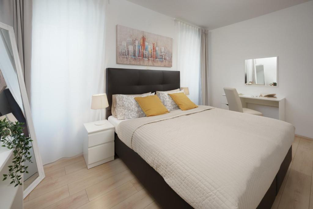 Łóżko lub łóżka w pokoju w obiekcie Apartments Antons