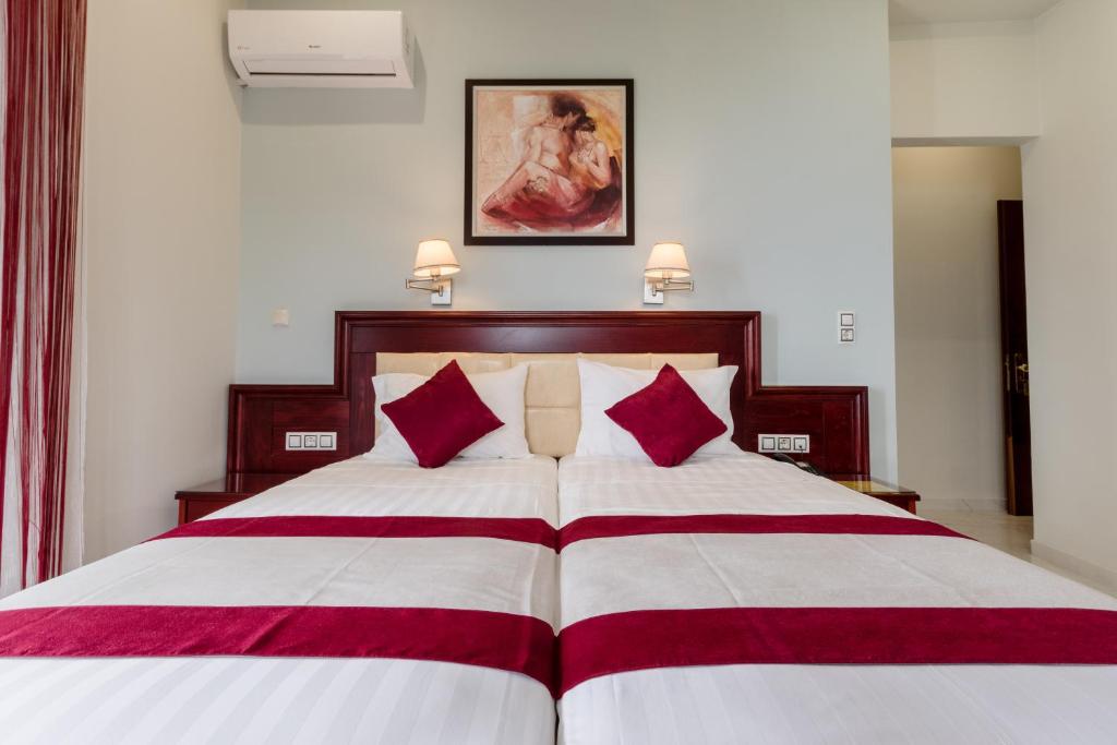 Postel nebo postele na pokoji v ubytování Hotel Villa Nisteri