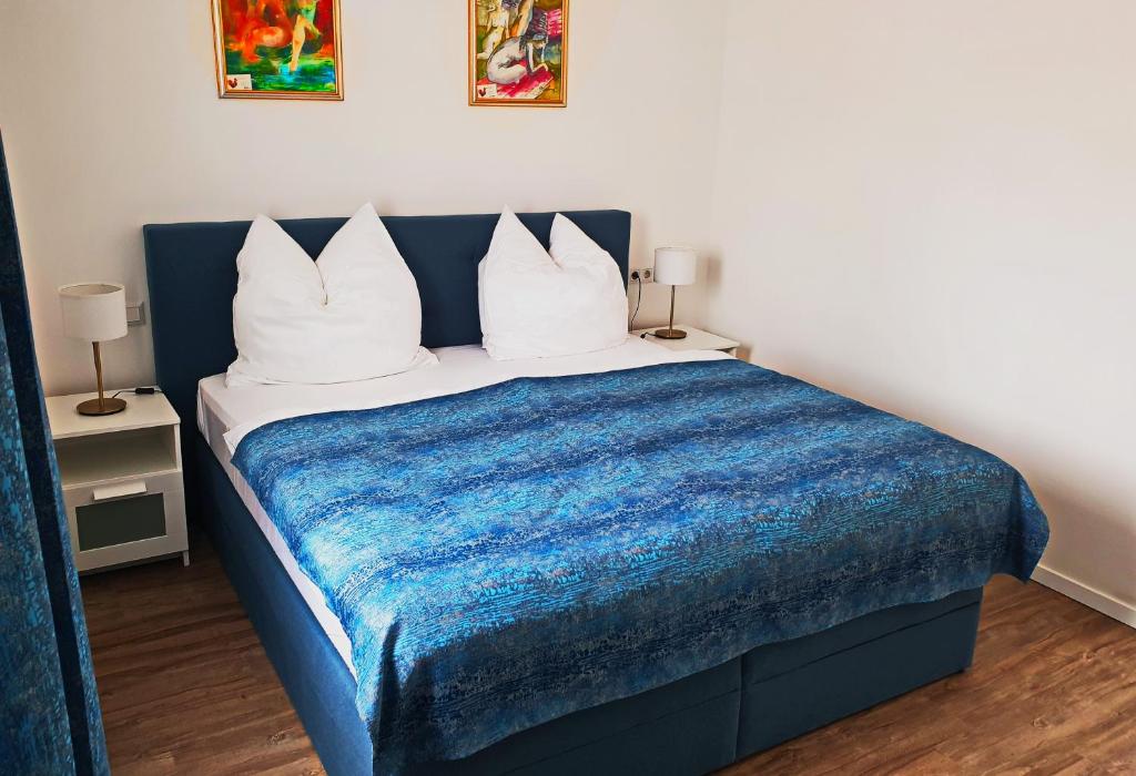 Postel nebo postele na pokoji v ubytování Catalleya Haus