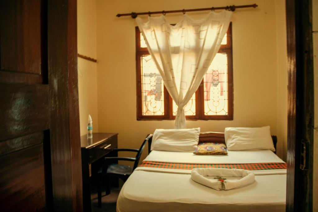 Posteľ alebo postele v izbe v ubytovaní Travellers Home (Kifumbu)