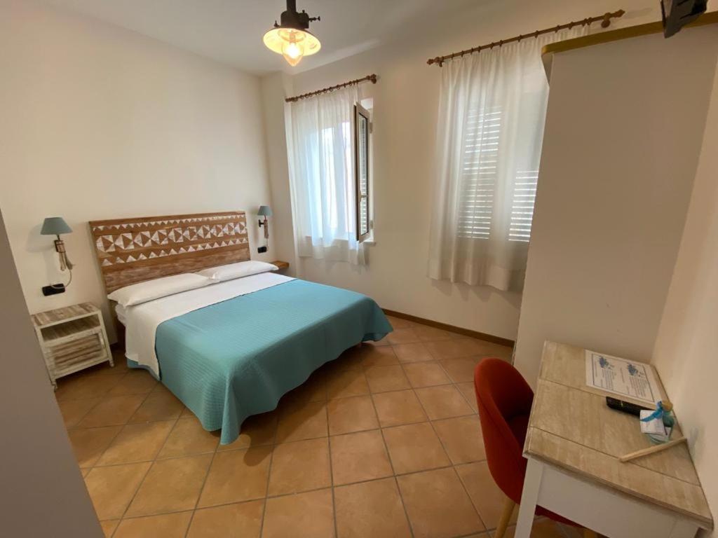 Postel nebo postele na pokoji v ubytování Camere Frangimare