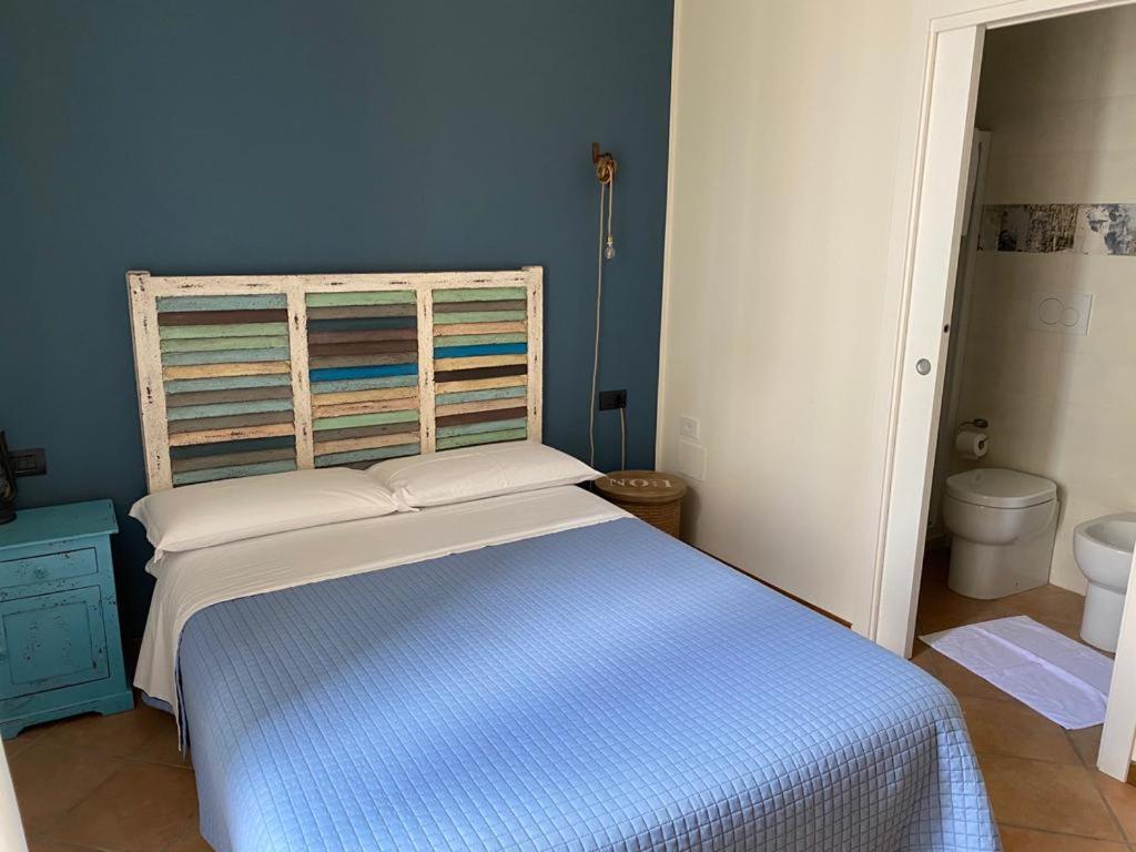Postel nebo postele na pokoji v ubytování Camere Frangimare