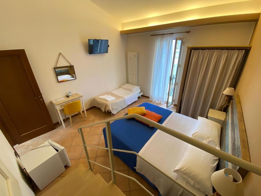 Postel nebo postele na pokoji v ubytování Camere Frangimare