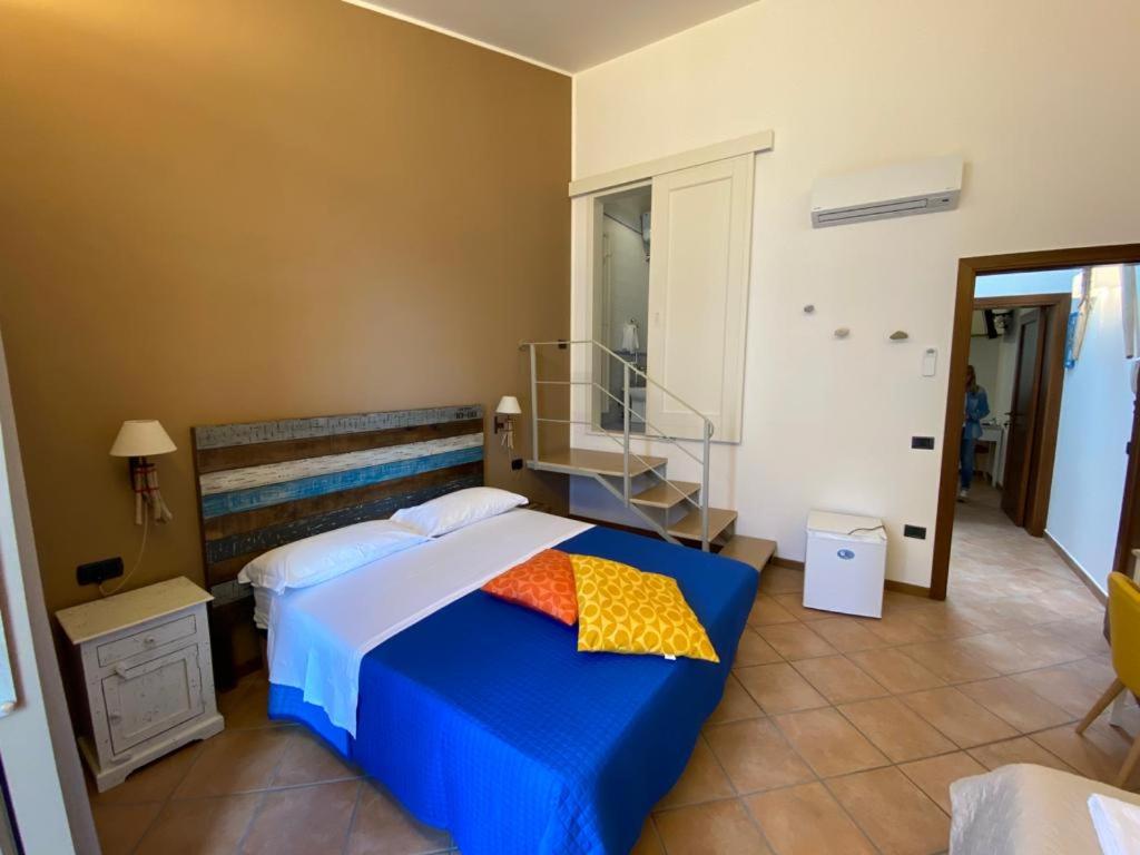 Postel nebo postele na pokoji v ubytování Camere Frangimare