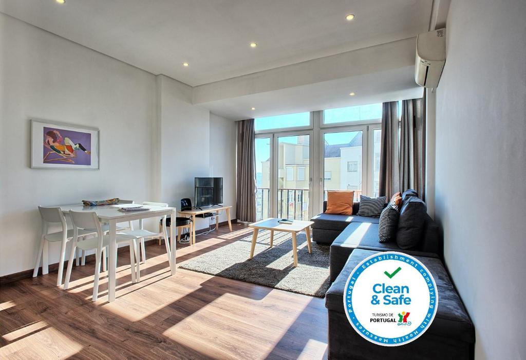 a living room with a couch and a table at Alameda Flat in Lisbon