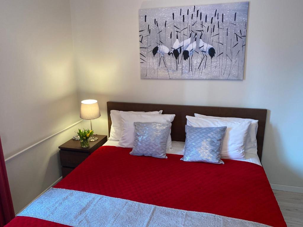 Cama o camas de una habitación en Good Time Apartments Warsaw - Świętokrzyska
