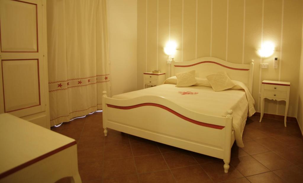 Postel nebo postele na pokoji v ubytování Hotel Stella D'Oro