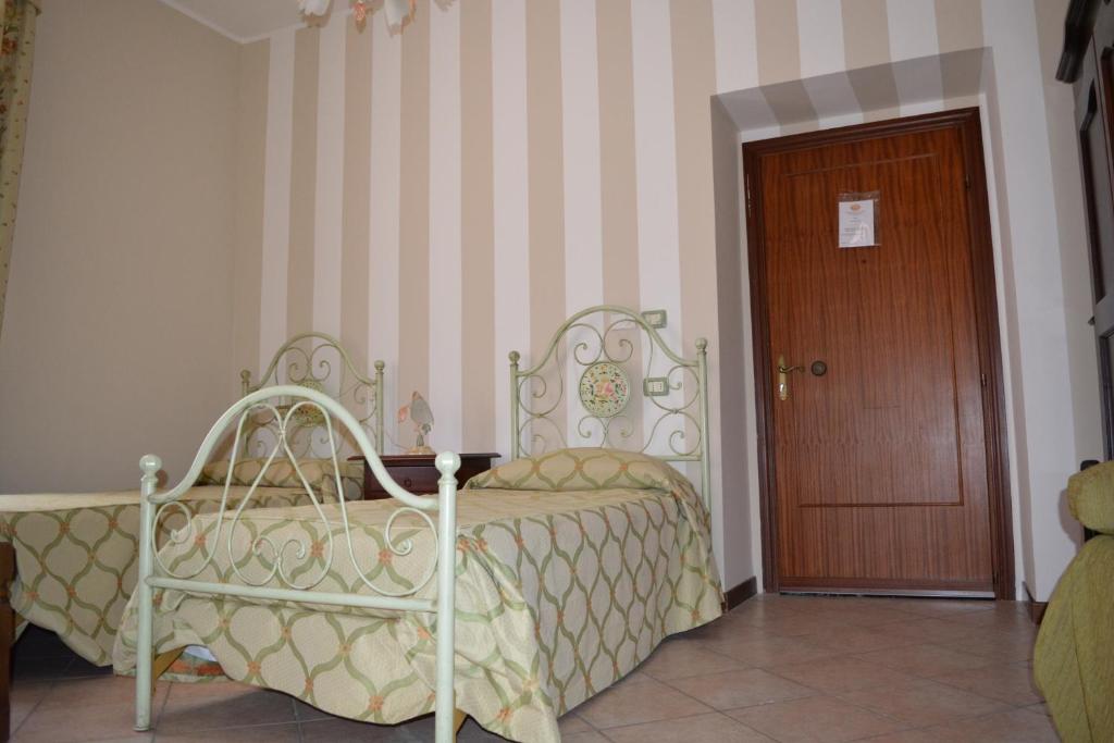 Postel nebo postele na pokoji v ubytování Ai 3 Archi