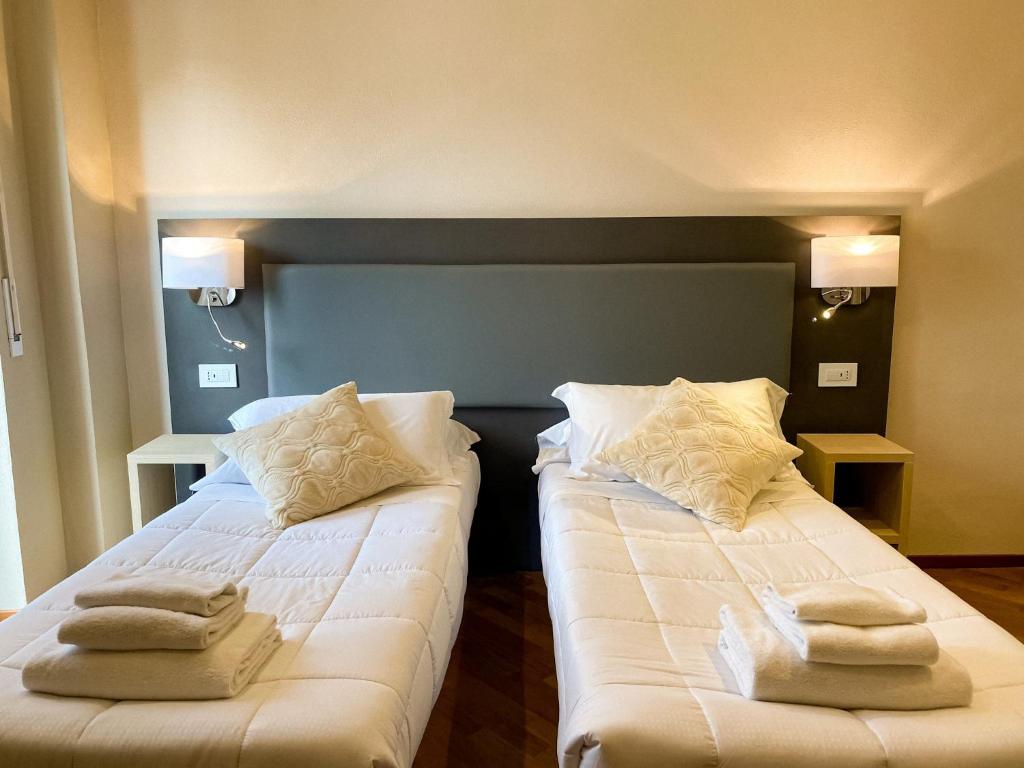 Postel nebo postele na pokoji v ubytování Hotel Victoria