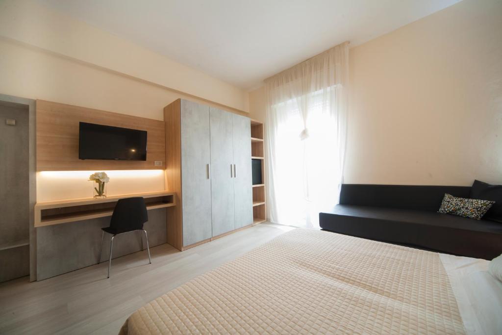 Postel nebo postele na pokoji v ubytování Hotel Ricchi