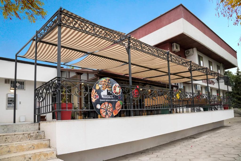 a building with a balcony with a skateboard on it at Hanovete Hotel in Pliska