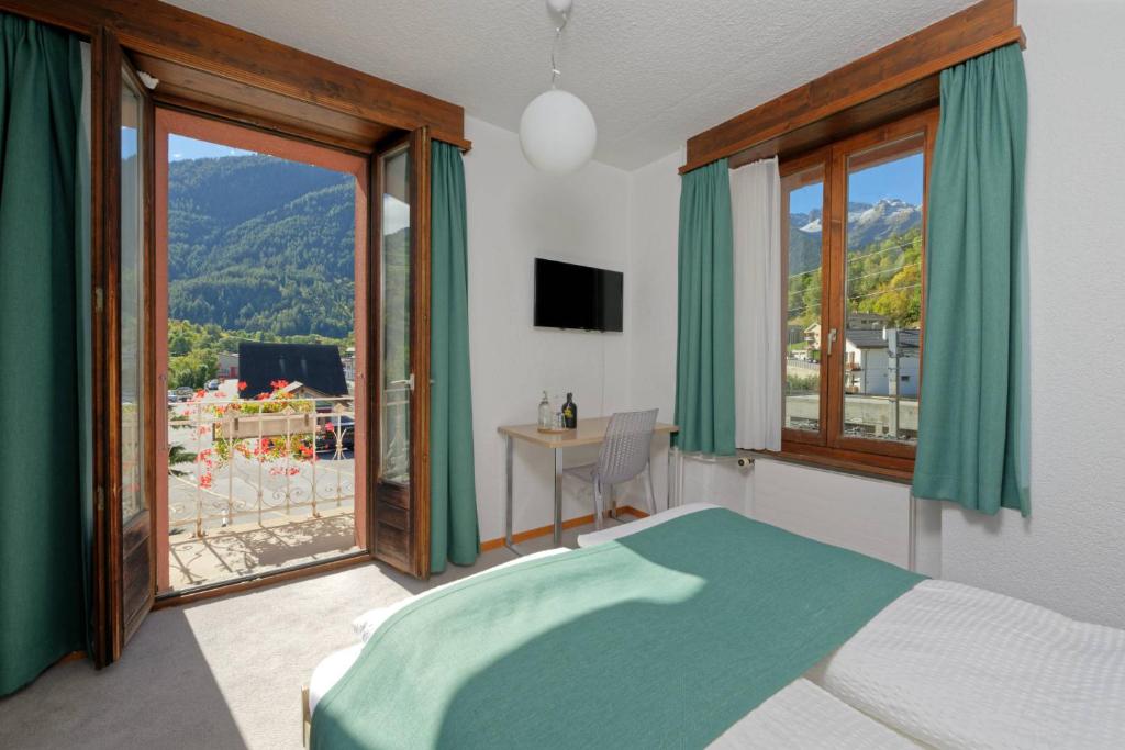 Postel nebo postele na pokoji v ubytování Hôtel Terminus
