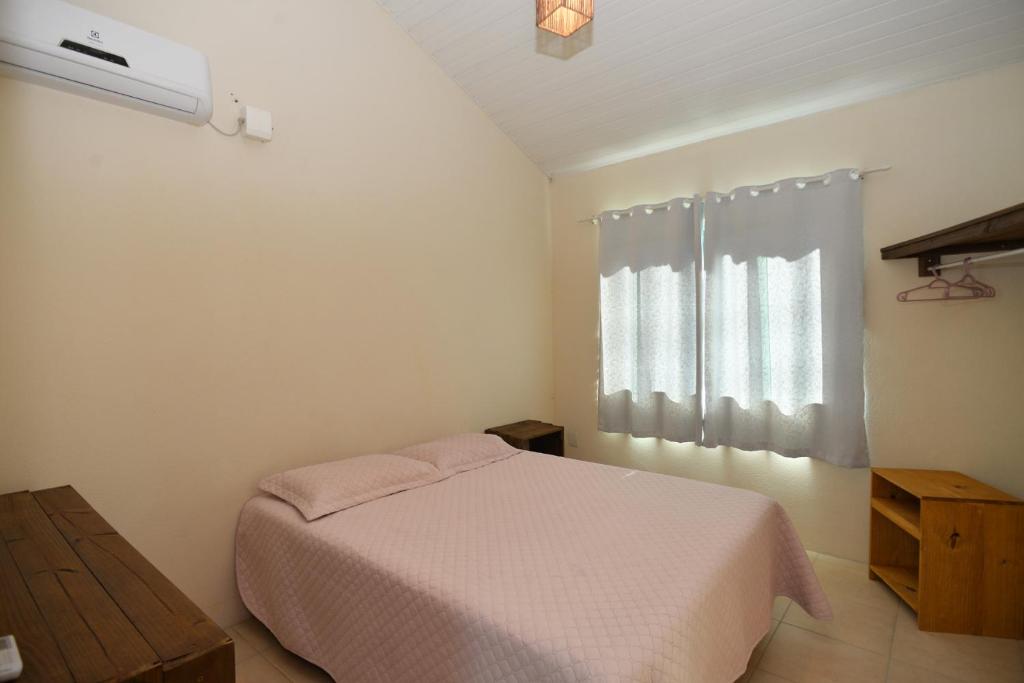Cama ou camas em um quarto em Pousada Sítio Olho D'Água
