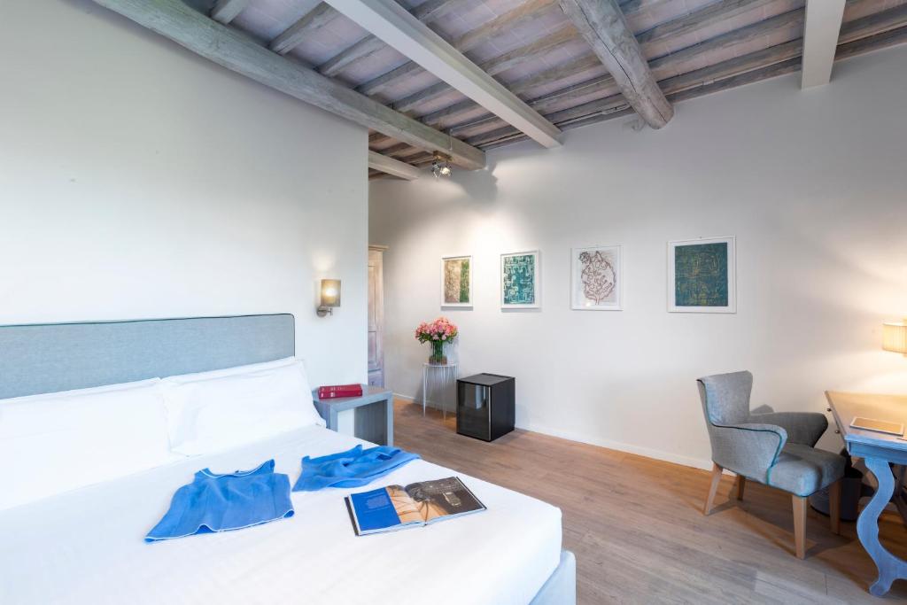 Postel nebo postele na pokoji v ubytování Relais Le Macine Di Stigliano