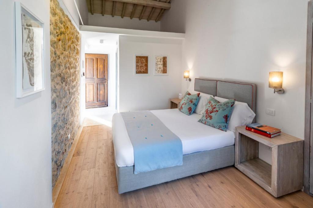 Postel nebo postele na pokoji v ubytování Relais Le Macine Di Stigliano