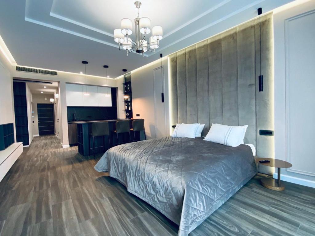เตียงในห้องที่ Maristella Marine Residense Hotel Apartment