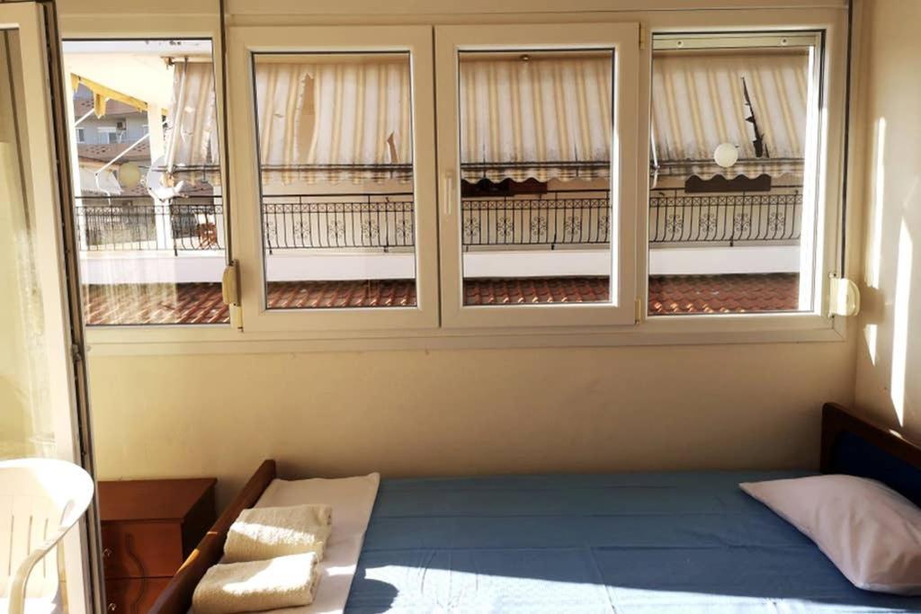 Postel nebo postele na pokoji v ubytování kallikratis apartment