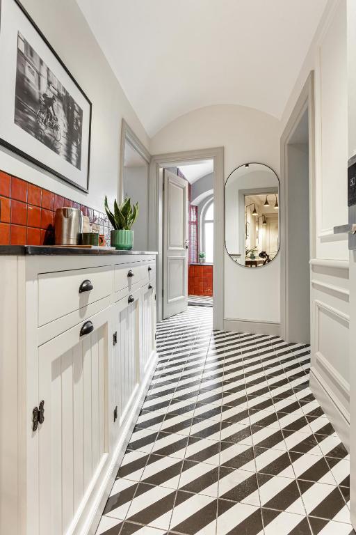 a kitchen with a black and white checkered floor at World House Boutique Hotel Galata in Istanbul