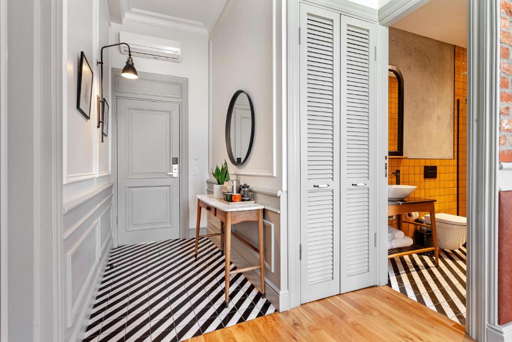 a bathroom with a sink and a mirror at World House Boutique Hotel Galata in Istanbul
