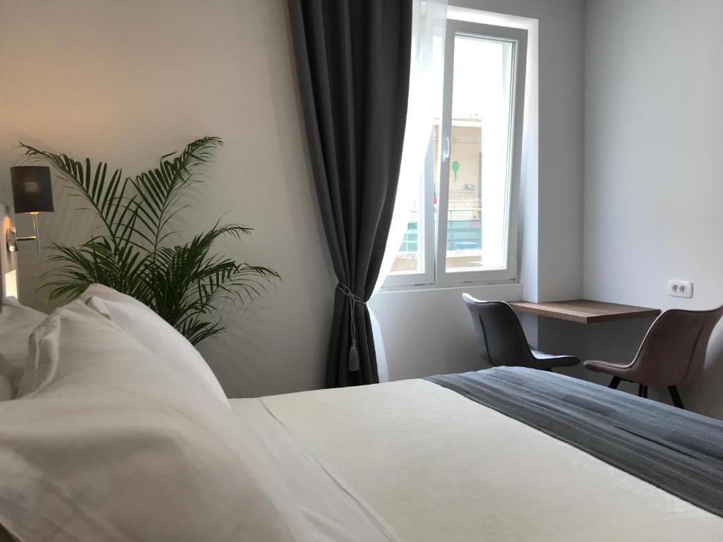 Postel nebo postele na pokoji v ubytování Antares Luxury Rooms