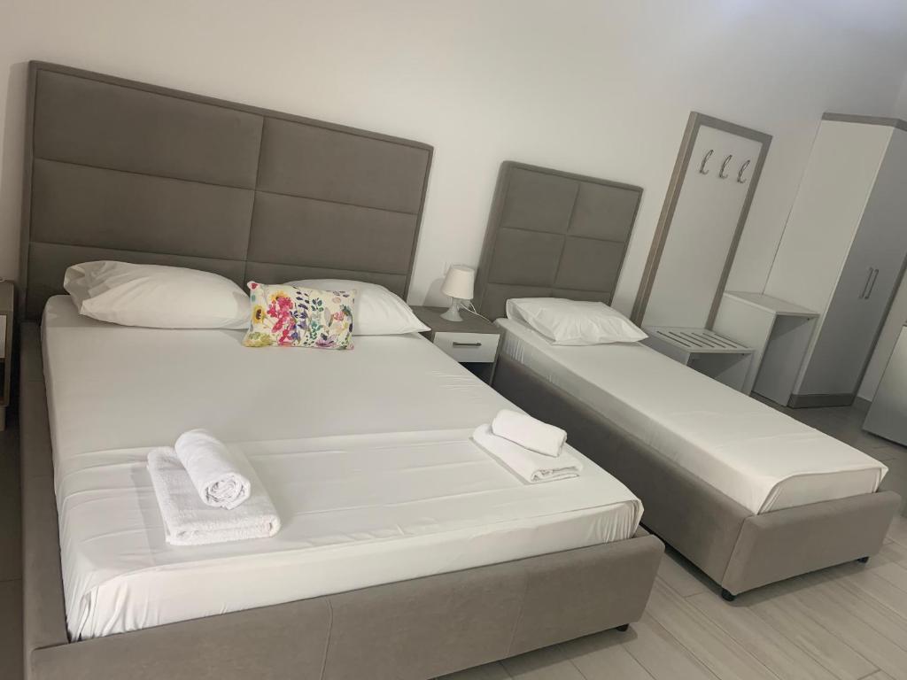 Postel nebo postele na pokoji v ubytování Hotel Riviera
