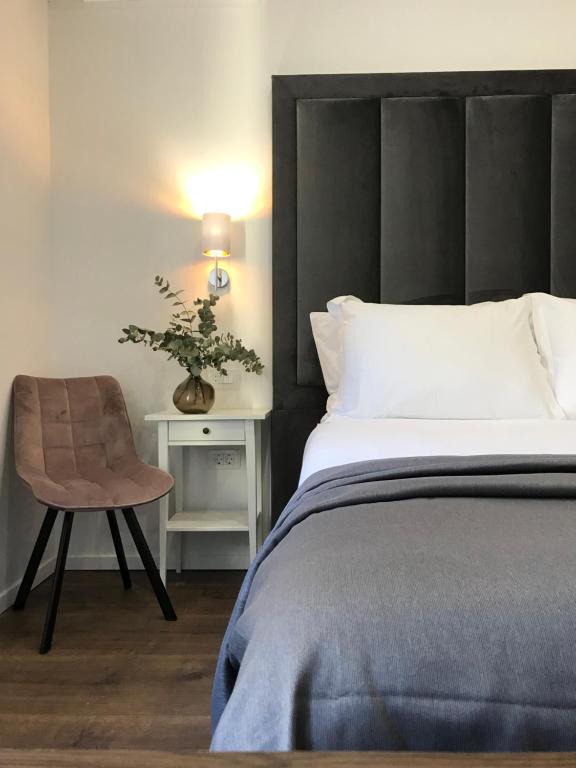 Postel nebo postele na pokoji v ubytování Antares Luxury Rooms