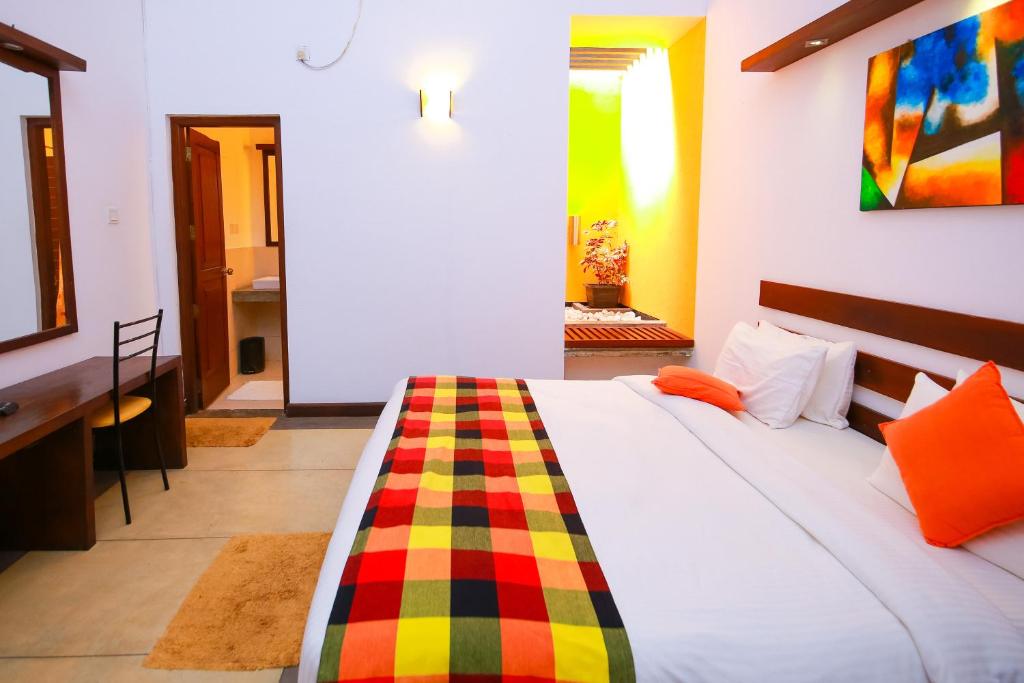 Postel nebo postele na pokoji v ubytování Hotel Alakamanda