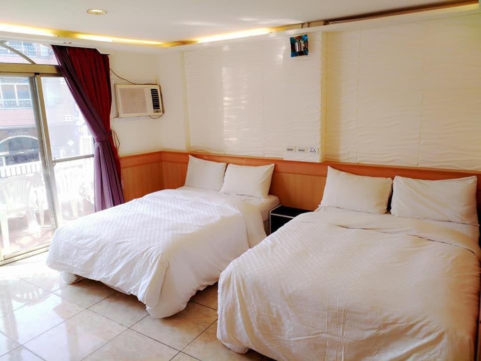 Postel nebo postele na pokoji v ubytování Hong Ben Hotel