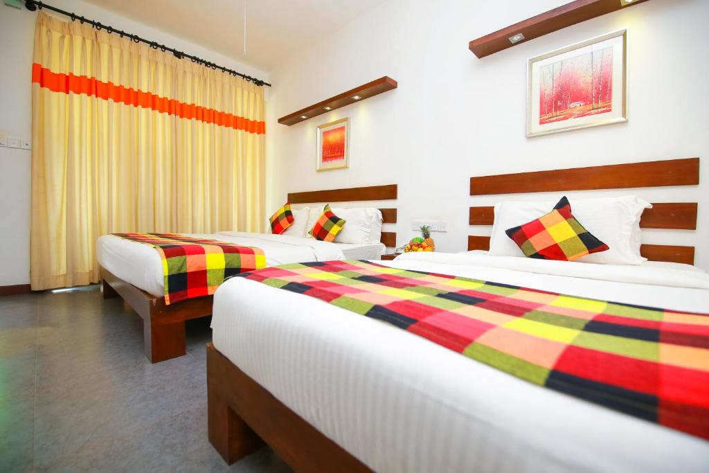 Postel nebo postele na pokoji v ubytování Hotel Alakamanda