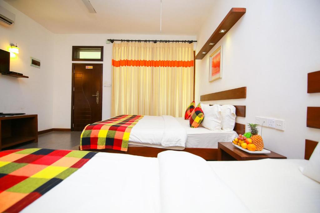Postel nebo postele na pokoji v ubytování Hotel Alakamanda