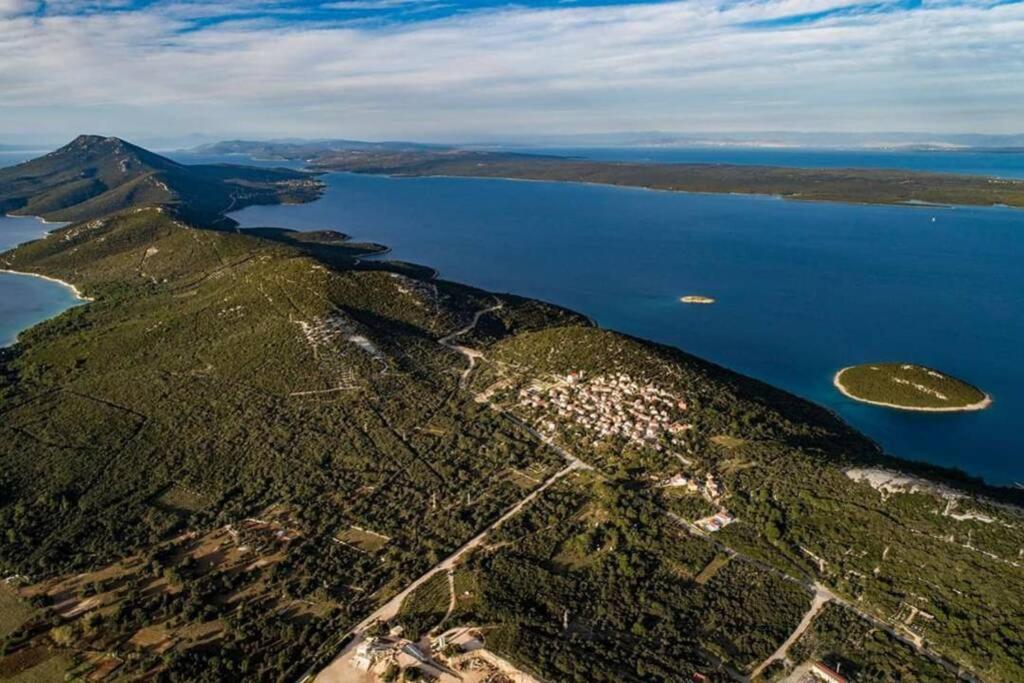 an aerial view of an island in the water at Apartman Opal in Čunski