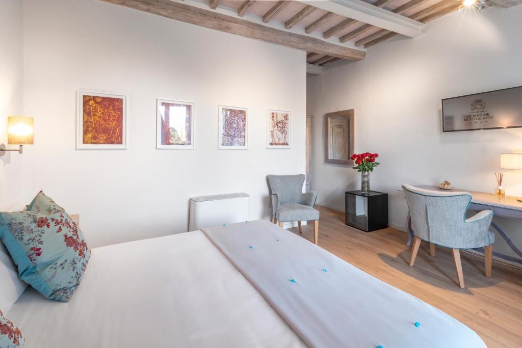 Postel nebo postele na pokoji v ubytování Relais Le Macine Di Stigliano