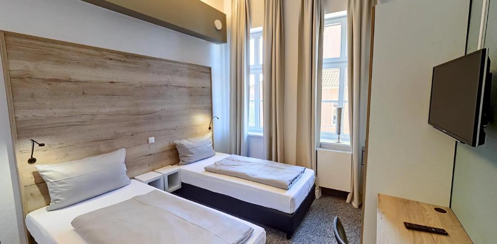 TV a/nebo společenská místnost v ubytování Boardinghouse Emden