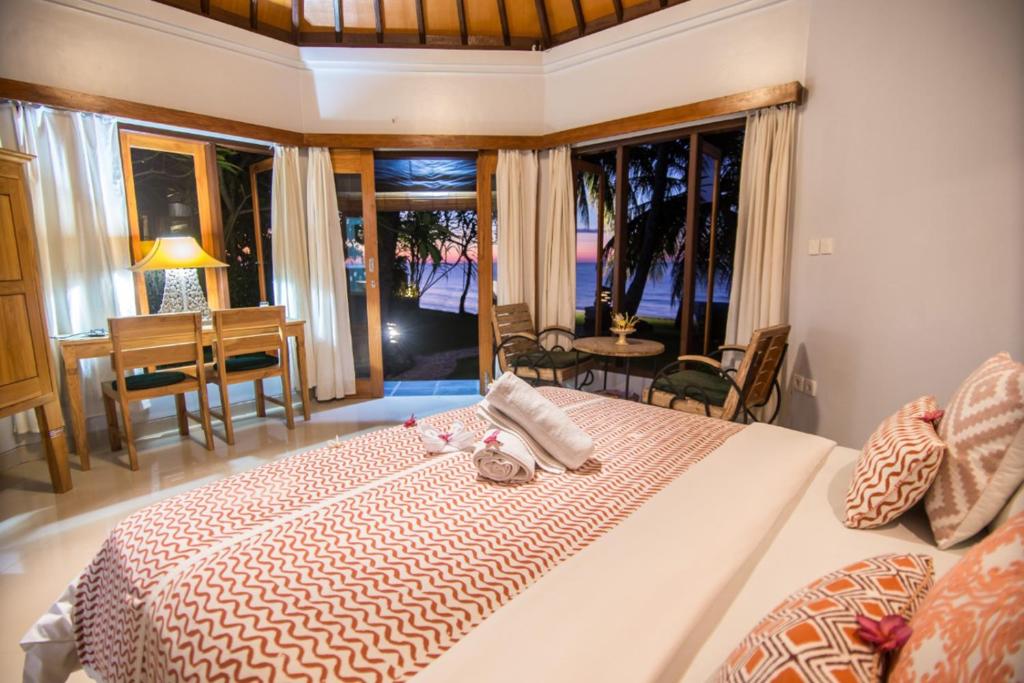 Postel nebo postele na pokoji v ubytování Mojito Beach Villas