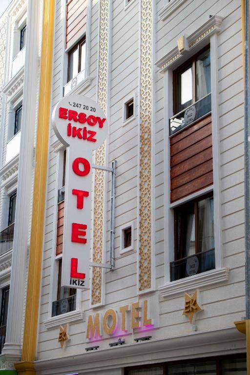 a hotel sign on the side of a building at Ersoy İkiz Otel in Antalya