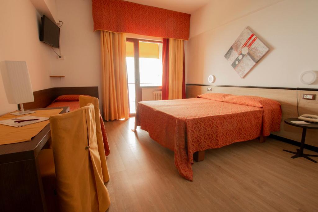 Postel nebo postele na pokoji v ubytování Hotel San Zeno