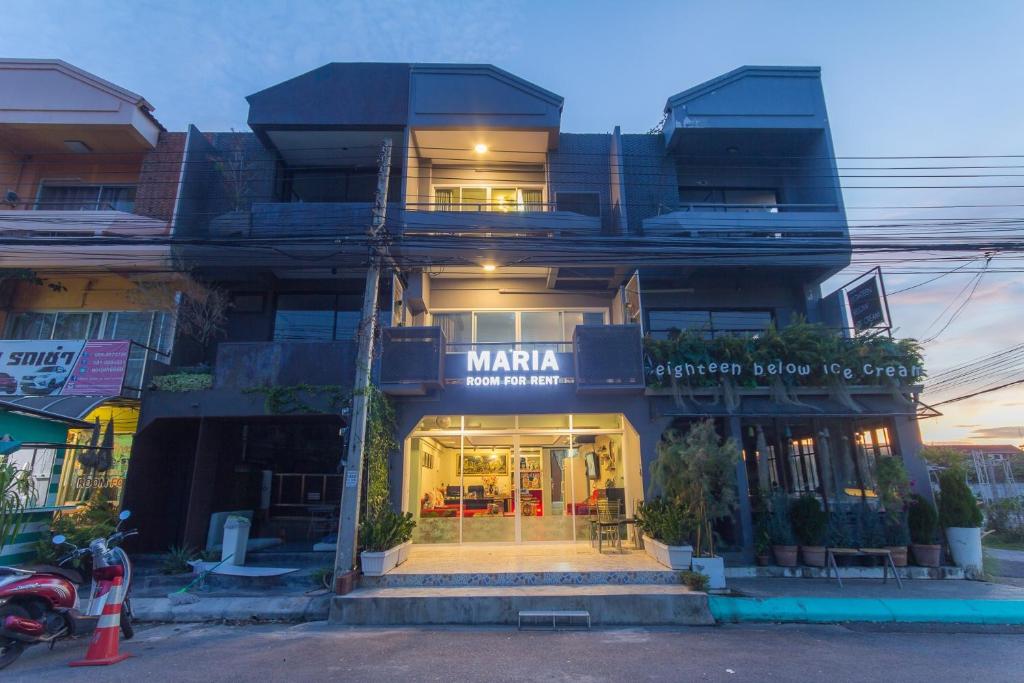 a building with a store in front of it at Maria Room HuaHin in Hua Hin