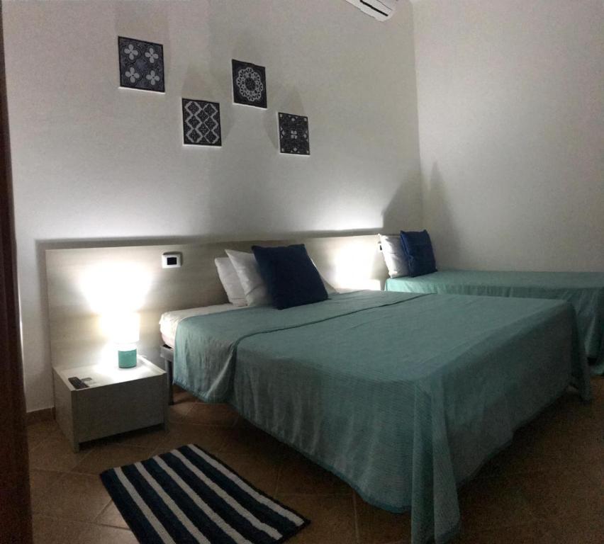 Postel nebo postele na pokoji v ubytování Villa Laregina
