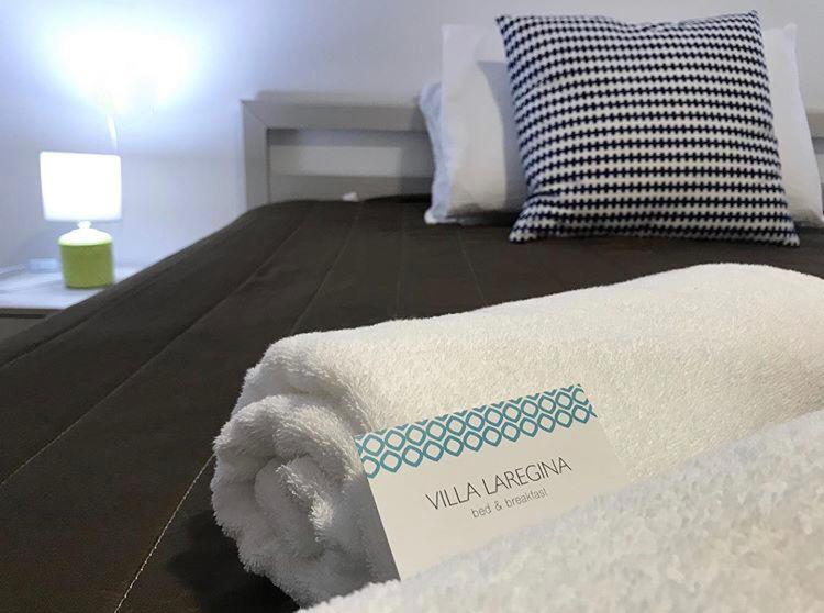 Postel nebo postele na pokoji v ubytování Villa Laregina