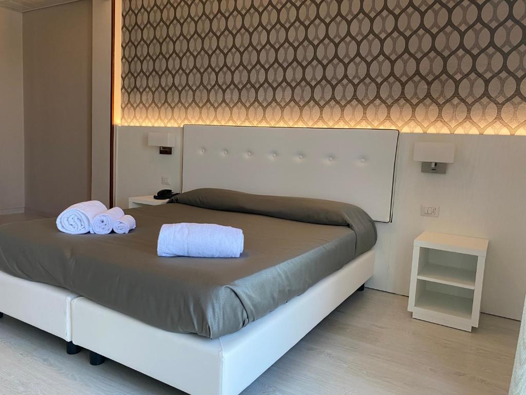 Postel nebo postele na pokoji v ubytování Hotel Biancamano