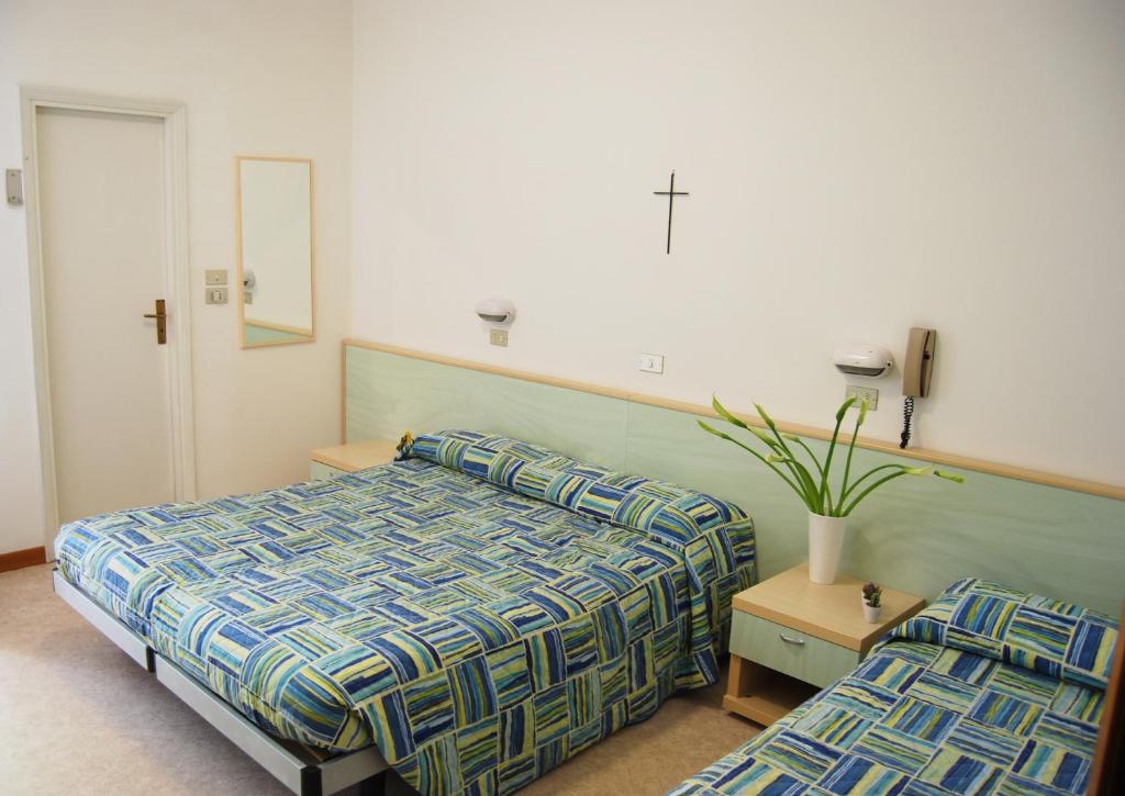 Postel nebo postele na pokoji v ubytování Hotel Solemare