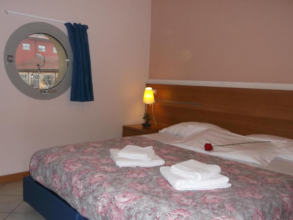 Postel nebo postele na pokoji v ubytování Albergo Meublè Abatjour