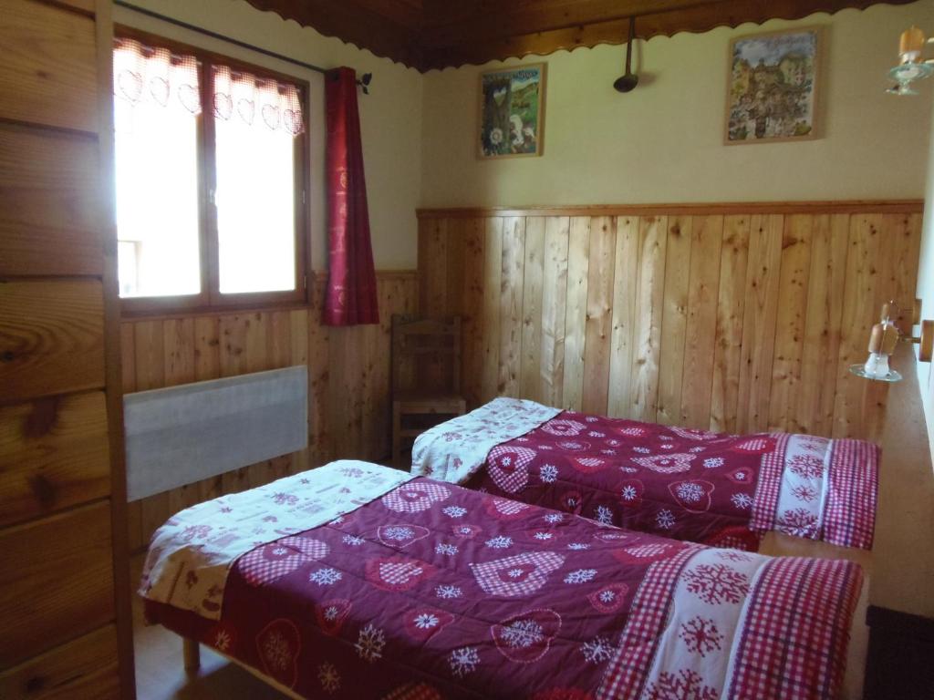 Voodi või voodid majutusasutuse Chalet l'aubépine résidence B&B toas