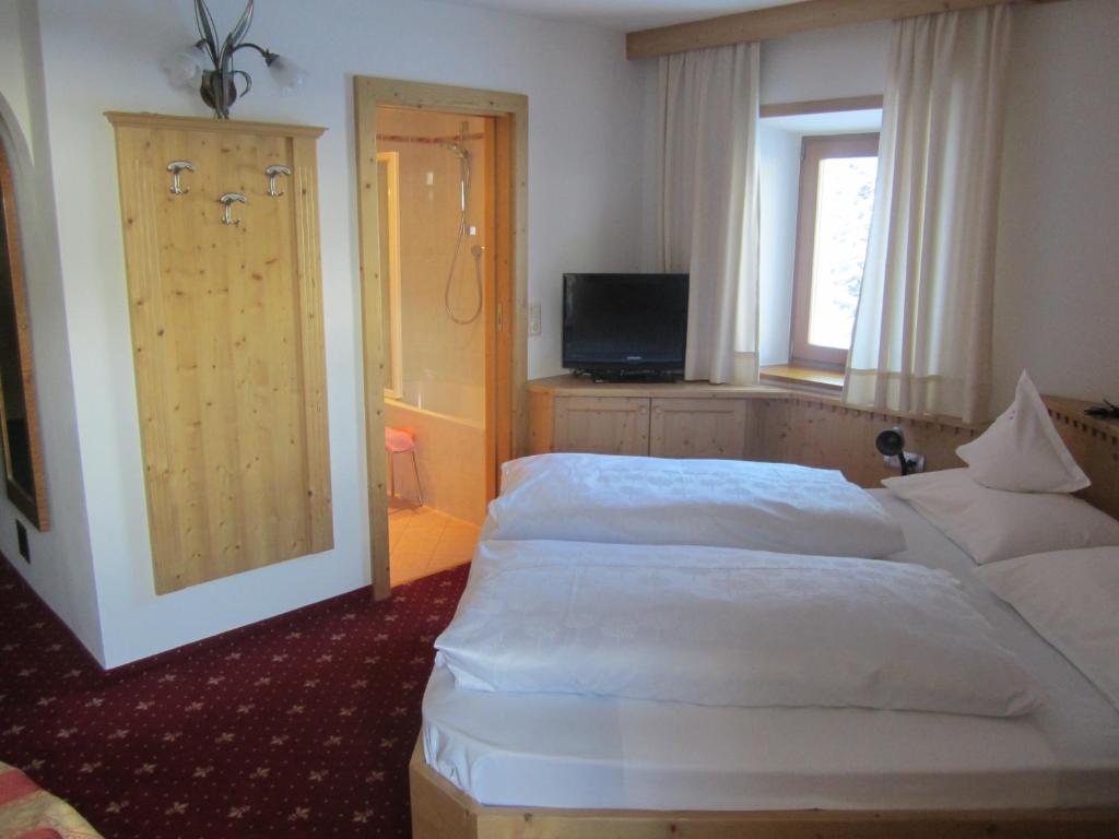 Postel nebo postele na pokoji v ubytování Hotel Ronce