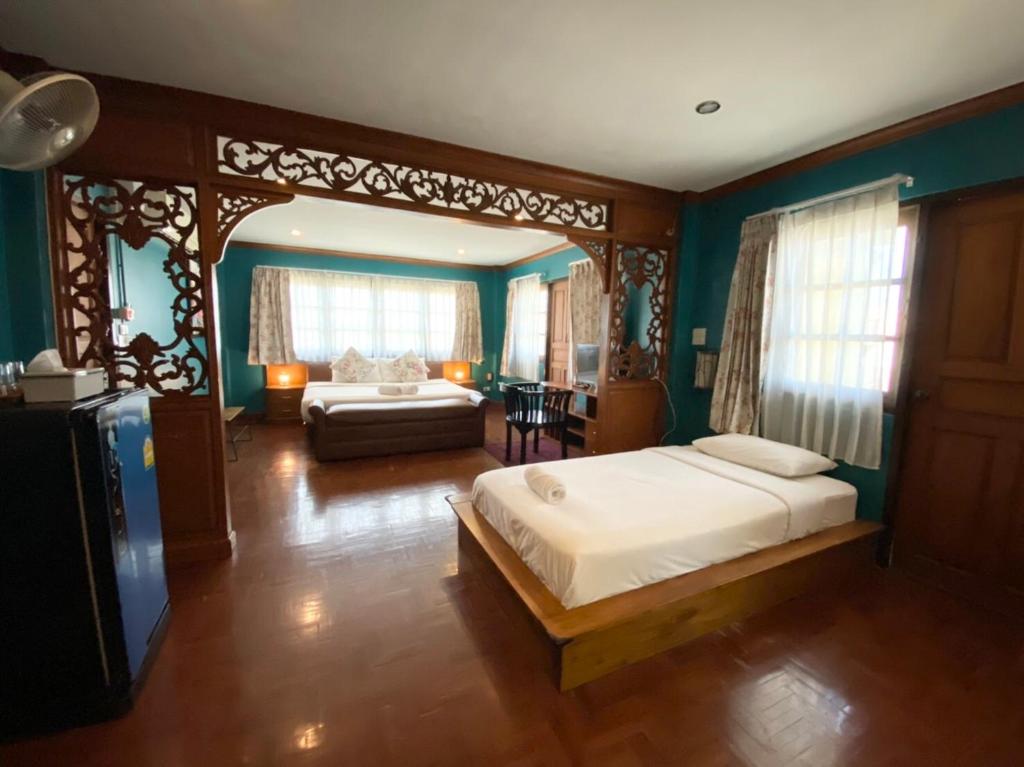 Кровать или кровати в номере Norn-Nanta House